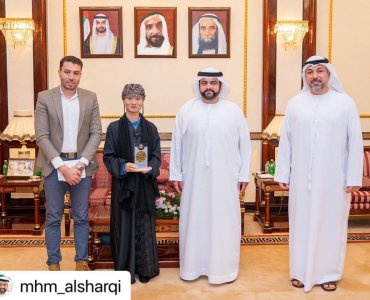 Mohammed Al Sharqi meets with student Mona Wang Yue, affiliated with the Fujairah Academy of Fine Arts, who won second place in the seventh annual art exhibition at Al Qasimia University, entitled “Artistic Radiances,” in the Arabic Calligraphy category.