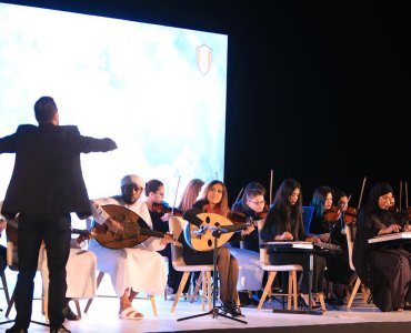 The participation of the orchestra of the students of the Academy of Fine Arts in Fujairah at the ceremony held by the Municipality of Fujairah at the meeting of municipal employees.